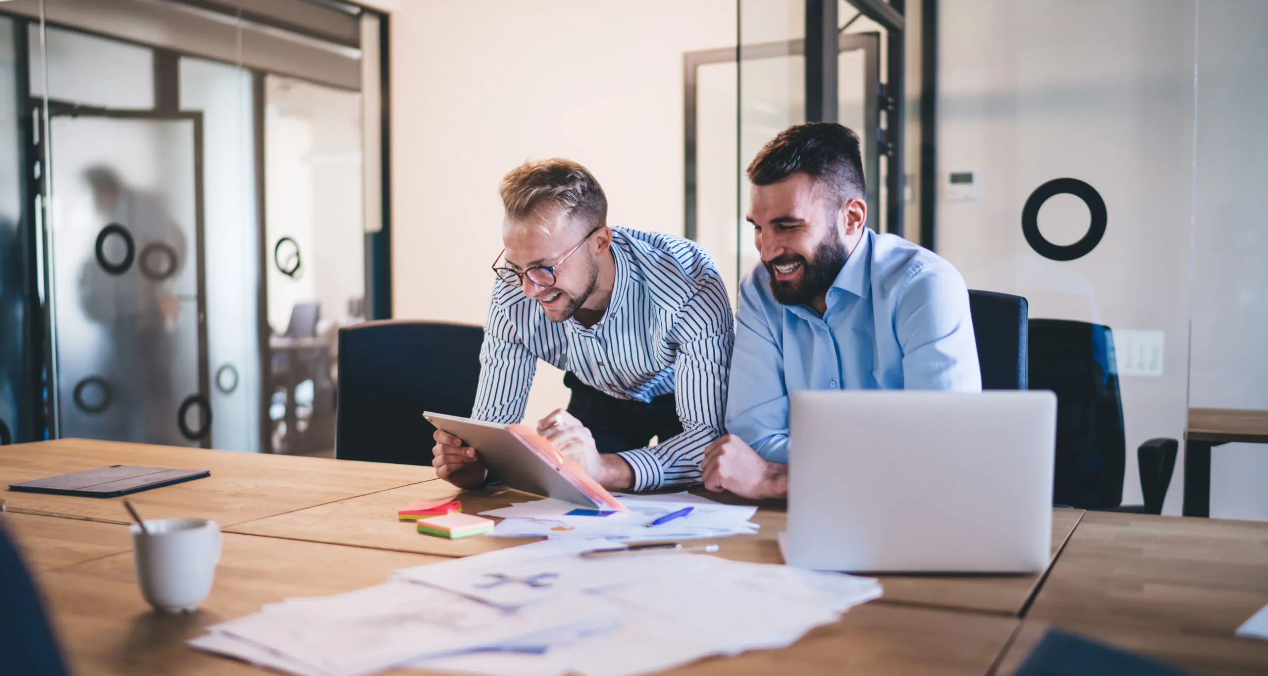 Successful,Young,Male,Colleagues,Having,Friendly,Conversation,While,Making,Research